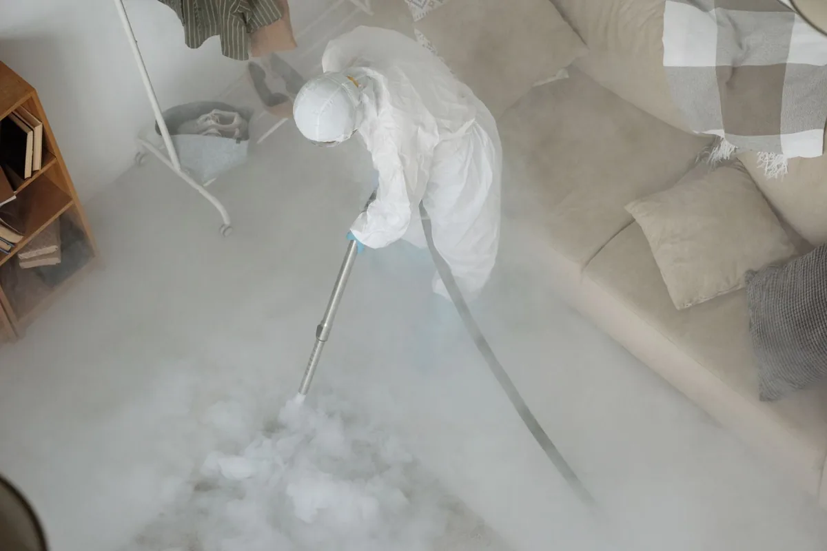 Biohazard cleanup technician in protective equipment, Karns, TN
